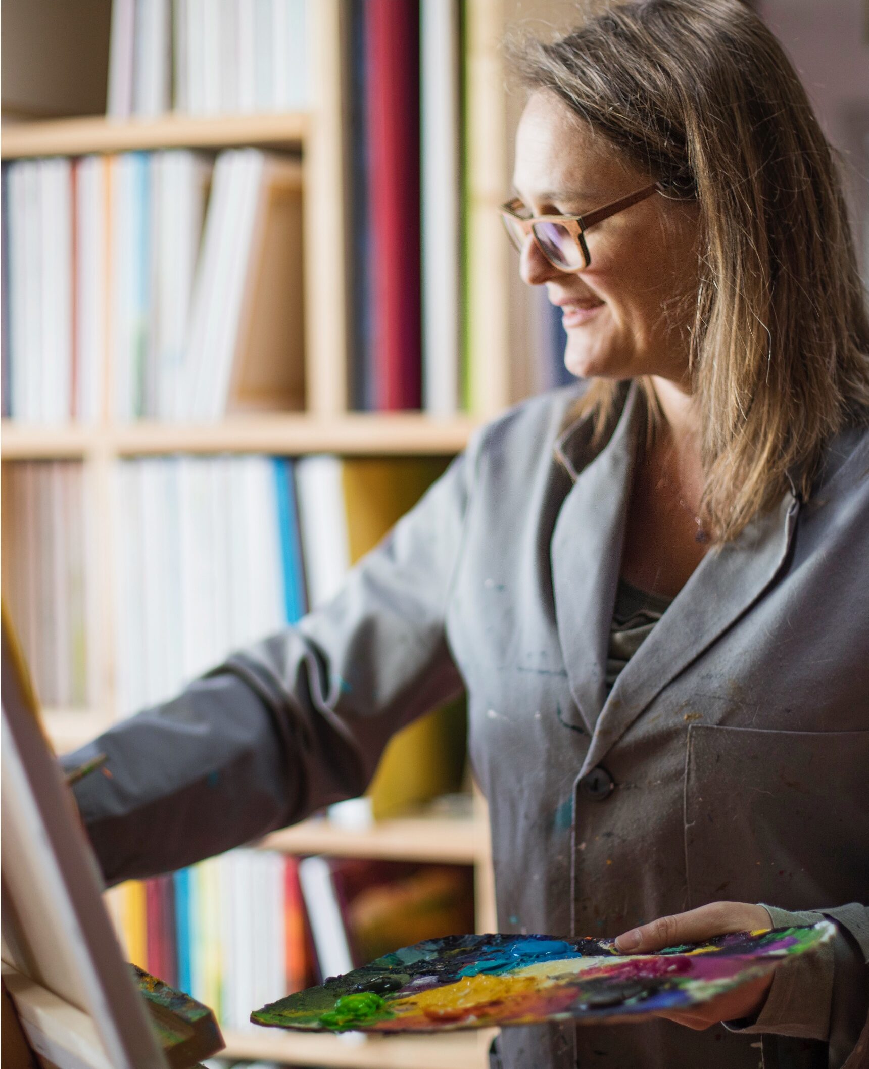 Sabine Thalhammer, artist and painter, at work at her easel in her studio in Leutershausen